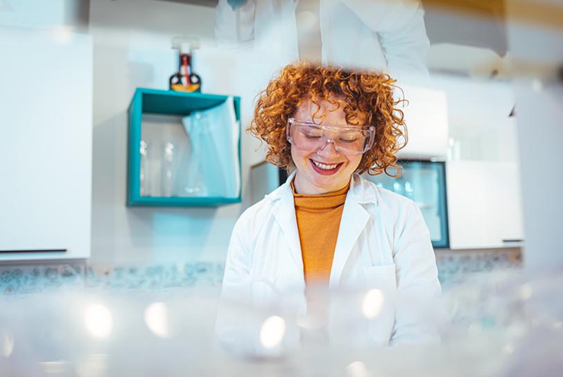 woman with red hair in a lab coat